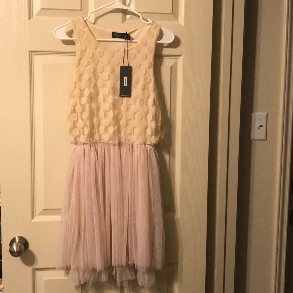 Flirty ivory and blush polka dot dress